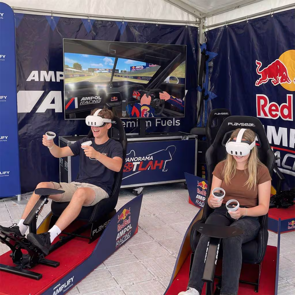 Two fans in VR racing seats taking a hot-lap for Red Bull Ampol Racing.